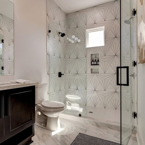 Spa-like upstairs bath w/ walk-in shower & beautiful patterned tile.