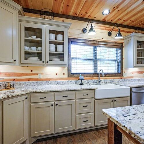 This kitchen is equipped with modern stainless appliances.