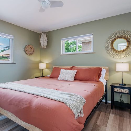 - wake up to sunshine and soft tones in this dreamy coral accented bedroom
- stretch out on the cozy bed, framed by golden lighting and designer flair
- perfect blend of comfort and style, ideal for lazy mornings and restful nights