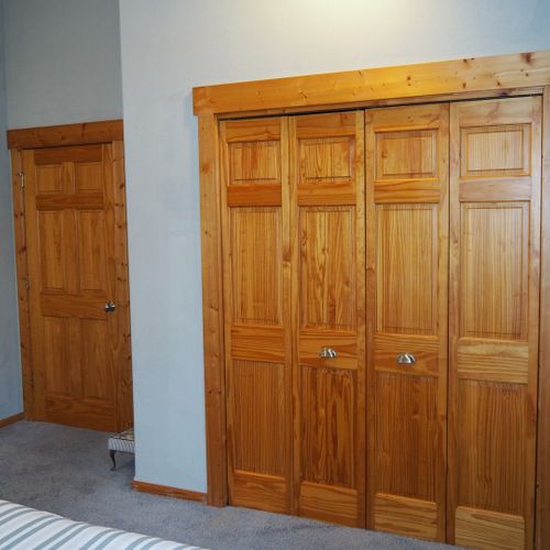 Bedroom #2 (second floor):  features a queen-size bed, desk with chair, mirror, and a large closet.