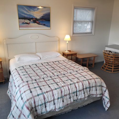 Bedroom #2 (upper level):  features a queen-size bed, great views of lake michigan, dresser, mirror, closet, desk, and private en suite full bathroom!