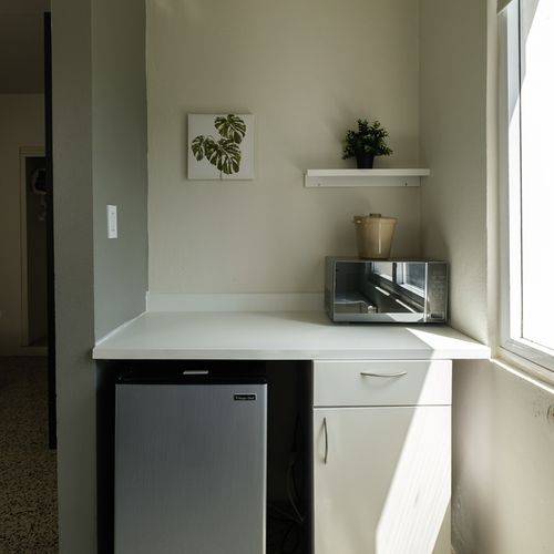 Enjoy the convenience of your personal kitchenette, complete with a mini-fridge and microwave – perfect for quick snacks, beverages, and simple meals during your stay.