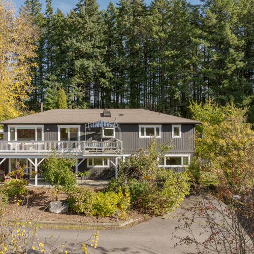 A peaceful forest retreat with elevated deck living—enjoy privacy, fresh air, and tranquil views surrounded by towering evergreens.