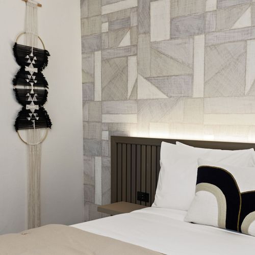 Drift off to sleep in our serene, stylish bedroom.