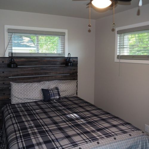 Bedroom #1:  features a queen-size bed, ceiling fan, and closet.