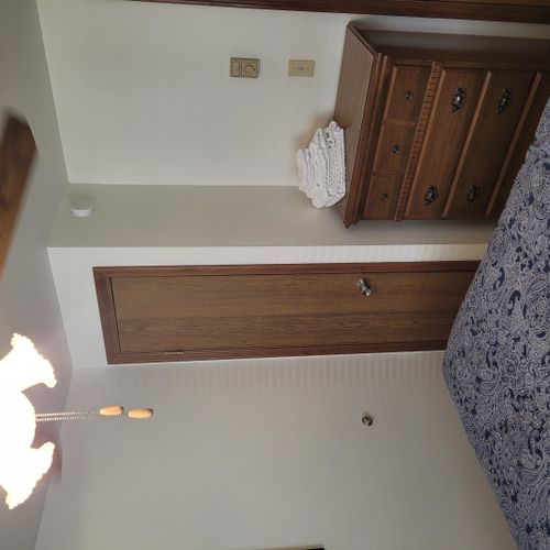 Bedroom #2:  features a full-size bed, ceiling fan, dresser, and closet.