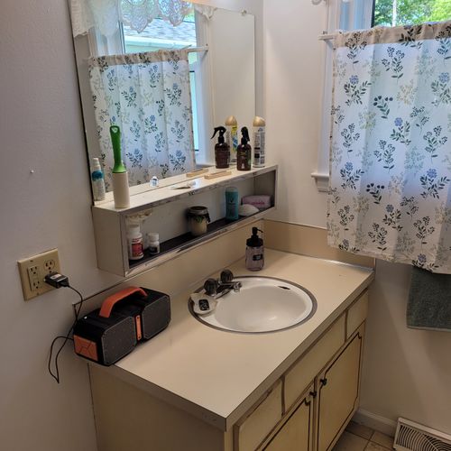 Bathroom #1 (first floor):  full bathroom on the first floor with a combination tub and shower.