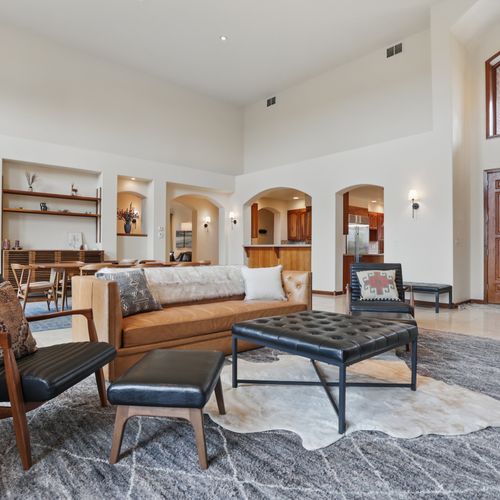 Chic design meets fresh air in this open, light-filled living room.