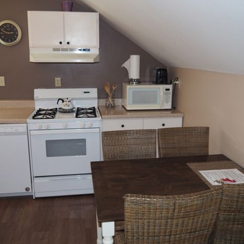 Dining area:  there is a convenient dining area near the kitchen. It includes a table and chairs for 4 adults.