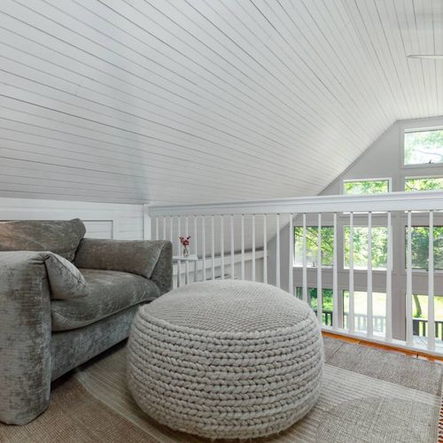 The sitting area for the master bedroom at the top of the stairs