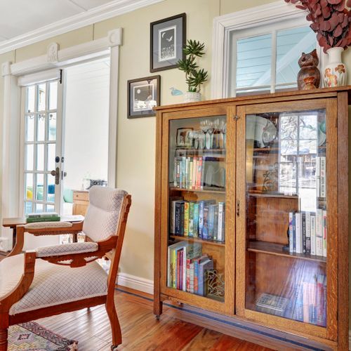 Vintage library with built-in shelves, warm wood tones, and a timeless reading nook.