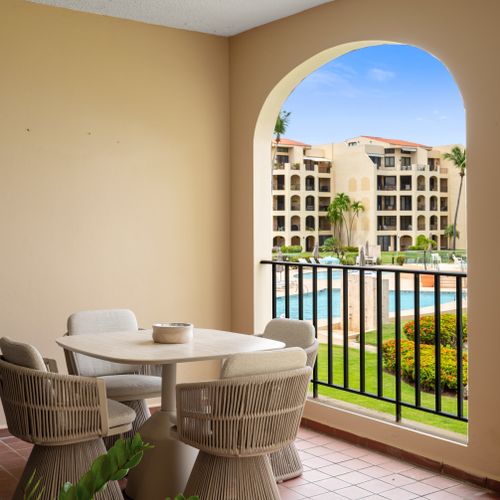 Step out onto your private balcony and enjoy refreshing breezes with glimpses of the sparkling pool.