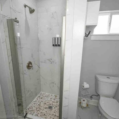 Clean, functional bathroom w/ shower & toilet — everything you need for a comfortable stay.