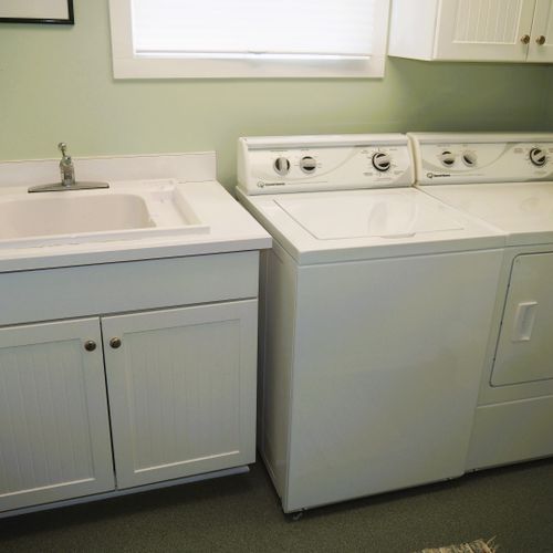 Laundry room (main floor):  the home has a very convenient main floor laundry room with a washer, dryer, and laundry sink.