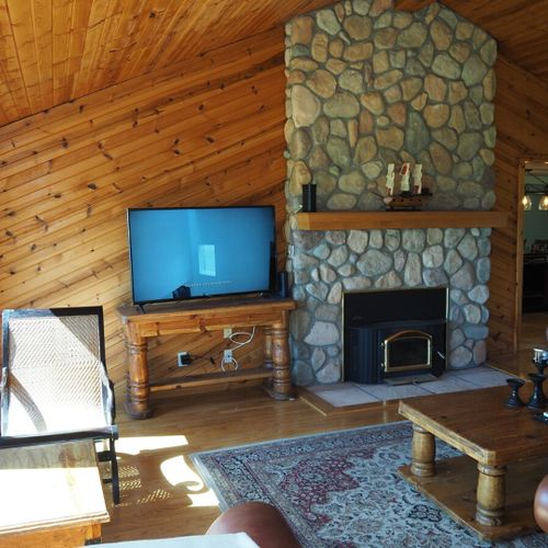 Living room:  the cabin has a huge living room with a gas fireplace and 
 great lake views!