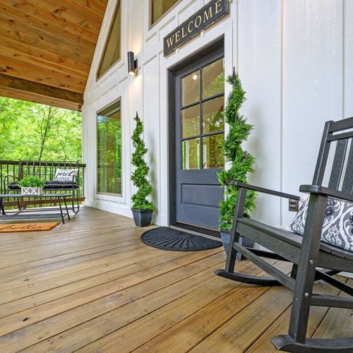 Rocking chairs on the front porch invite you in!