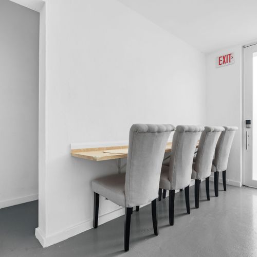 Minimalist dining in sleek grey tones.