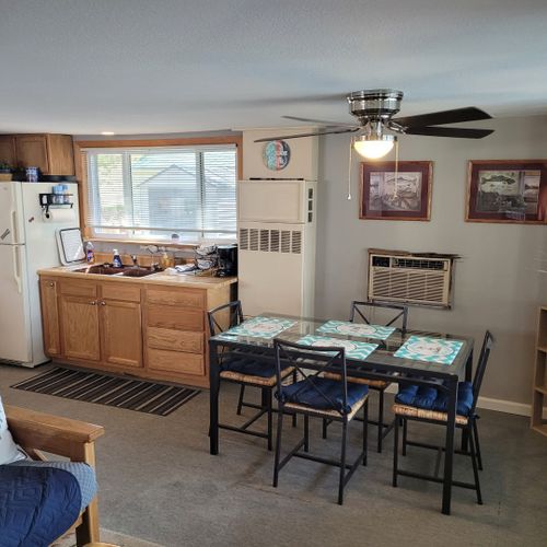 Dining area:  table and chairs for 4 adults are next to the living room.