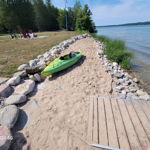 OVERVIEW:  The home also includes a private sandy beach and a private bonfire ring.  (The kayak in the photo is not included with the rental.)