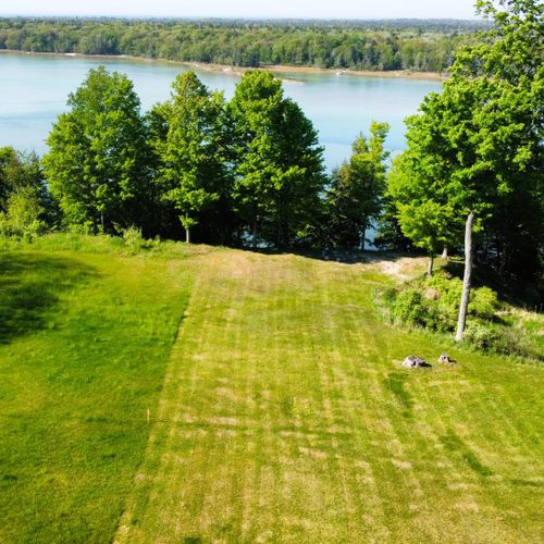 Exterior:  the beautiful backyard with long lake in the background.