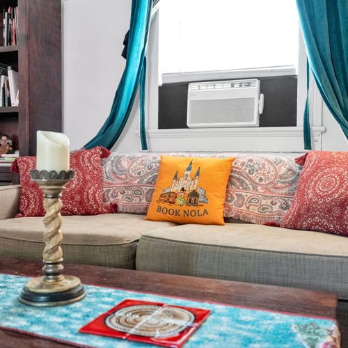 Relaxed living space w/ signature Book NOLA touches throughout.