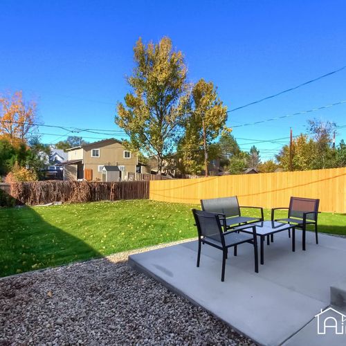 Slide open the glass doors and bring the outdoors inside with this backyard escape.