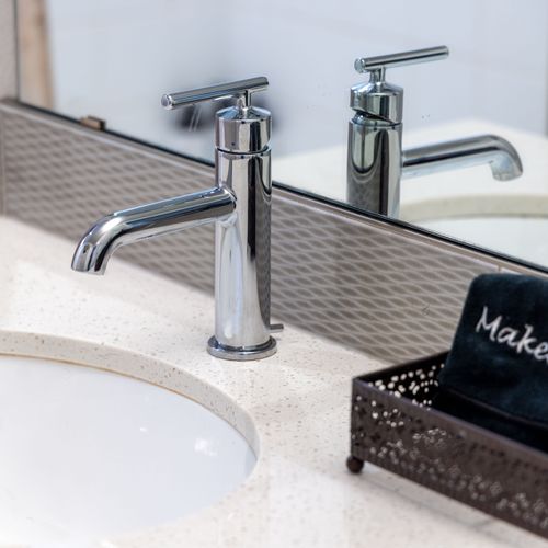 Spotless vanity space with sleek finishes and fresh feel.