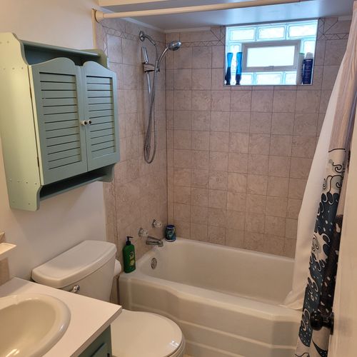 Bathroom #1:  full bathroom with a combination tub and shower.
