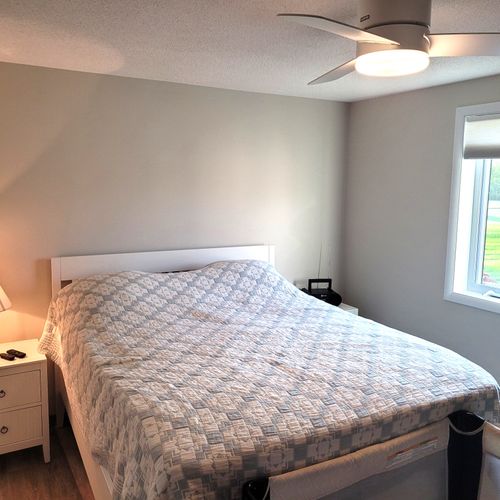 BEDROOM #2:  Features a queen-size bed, crib, ceiling fan, closet, nightstands, lamp, mirror, and a private desk and television