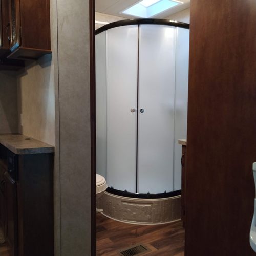 Bathroom #2:  full bathroom with a shower, sink, vanity, and toilet.