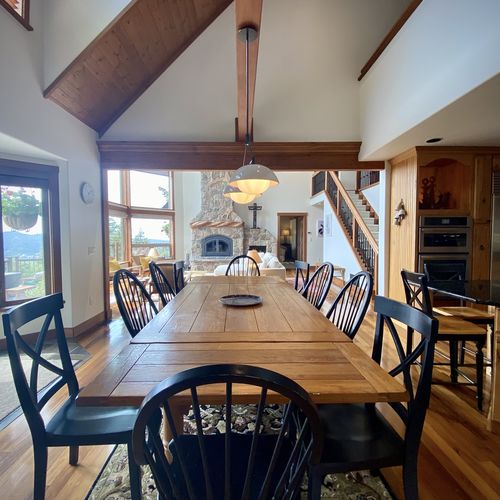 Dining room looks out to the living room and fireplace creating a warm and connected experience.