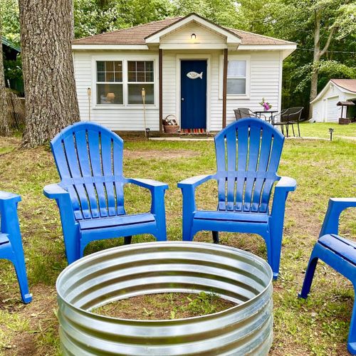 Overall:  the front of the cabin and the fun and family-friendly bonfire ring in the front yard.