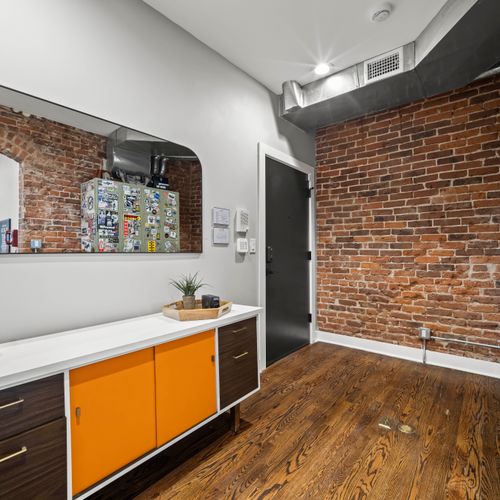 Organized home entryway with shoe storage and space for essentials.