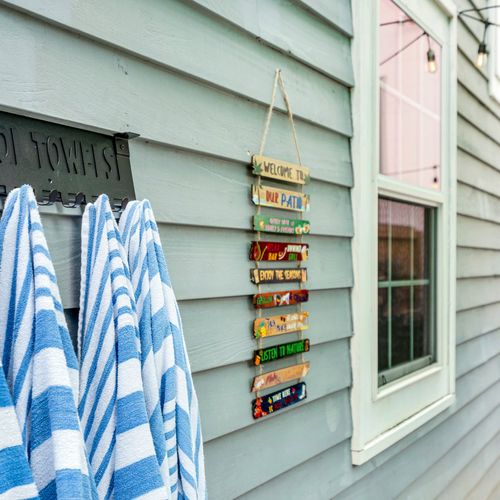 Poolside perfection! Fresh towels are ready for you to dive into comfort and relaxation in our cozy outdoor space.