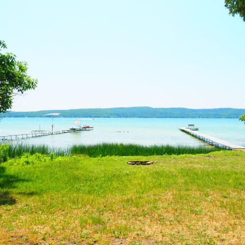 Exterior:  the fairly large backyard with a nice private lakefront and dock.