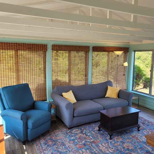 Sunroom:  the cottage has a very fun and family-friendly sunroom with a dining / game table, sofa, comfy chair, and a great view of crystal lake