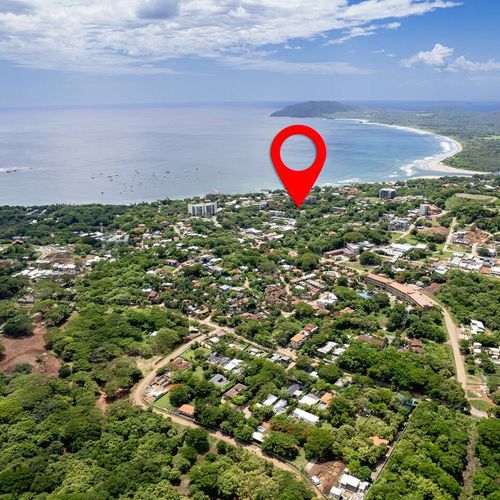 Tamarindo town beach and estaury with ta view of Playa Grande .