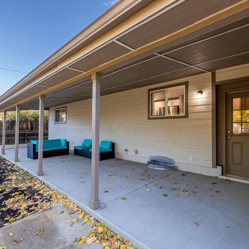 Step outside into the spacious backyard, complete with sectional seating.