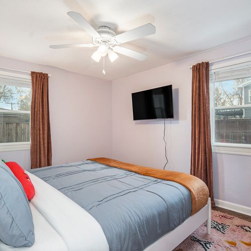 Relax in comfort in this cozy bedroom with a king-sized bed, providing the ideal space to unwind and recharge for your next day of exploration.