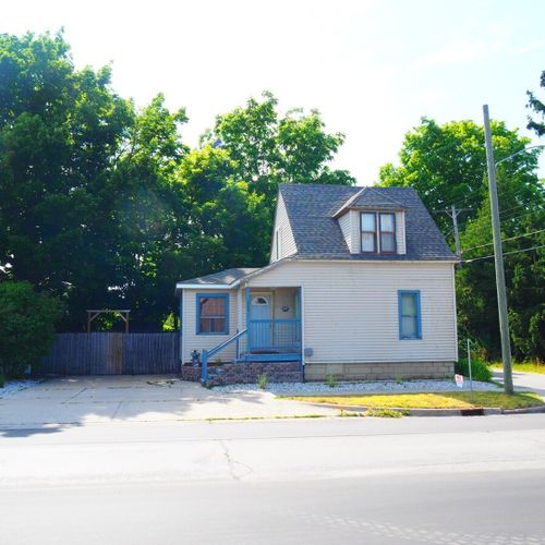 Exterior:  the front of the cottage in summer.