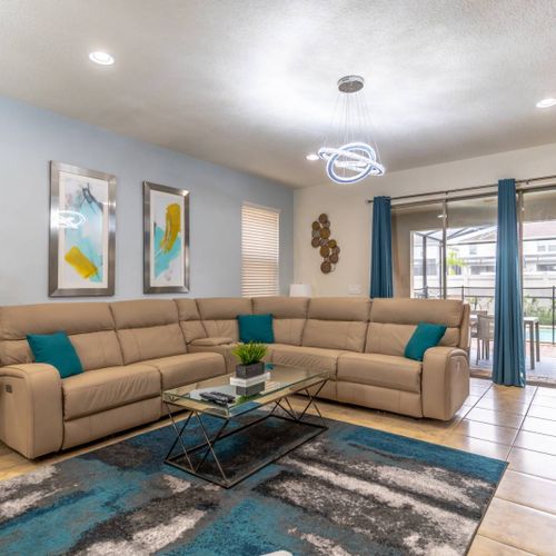 Comfortable & Modern Living Area with Wall Mounted Flat Screen TV