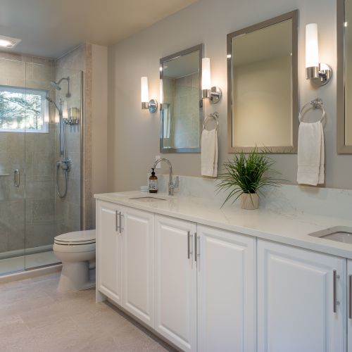 Guest bathroom with radiant floor heating, walk-in shower, and double vanity.  Shampoo, conditioner, soaps, and quality towels are provided.