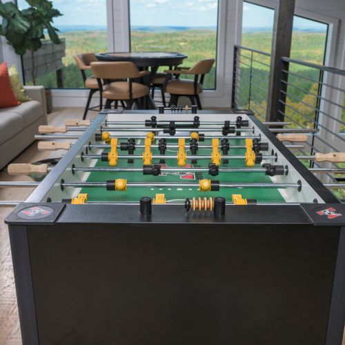 Foosball table & seating area with coffee table and stunning views.