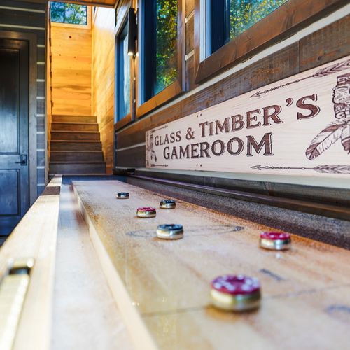 Just off the kitchen, Glass and Timber has an expansive game room with something for everyone, wrapped in warm rustic charm.