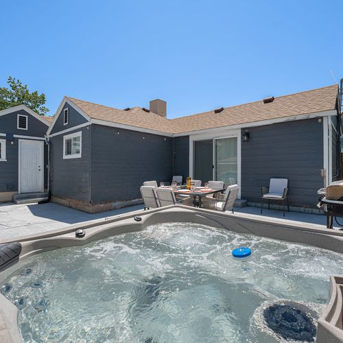 Hot tub + patio perfection—your private outdoor reset.