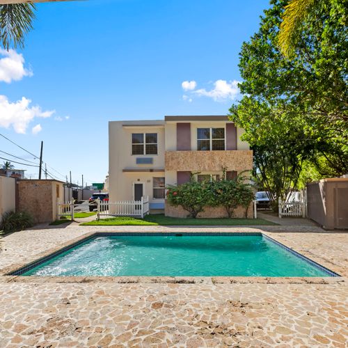 Escape to paradise! This inviting backyard and pristine pool offer the ultimate setting for unwinding and soaking up the sun in complete privacy.