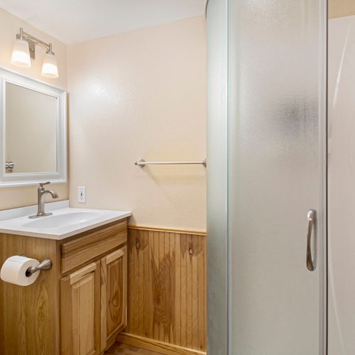 Functional with walk-in shower and earthy charm.