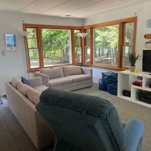 Living room:  the cottage has a very comfy and cozy living room with a sofa, loveseat, comfy chair, and television.