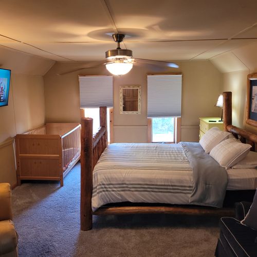 BEDROOM #3 (SECOND FLOOR):  Features a queen-size bed, comfy chair, sofa bed, baby crib, ceiling fan, dresser, and private live-streaming television.