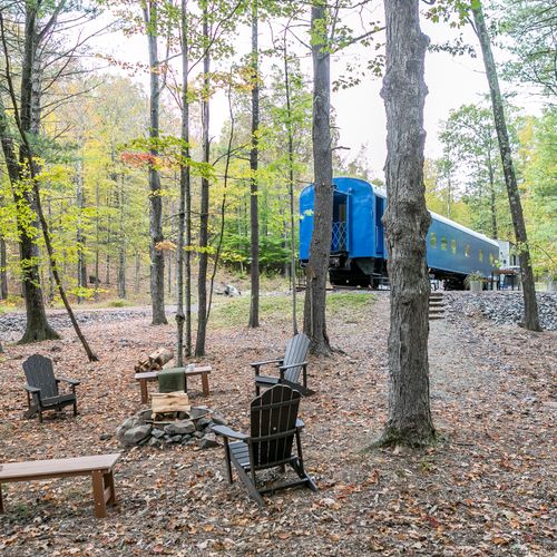 Outside area equipped with a fire pit, solar powered lighting , and an area for grilling and lazing the day away in the hammock.